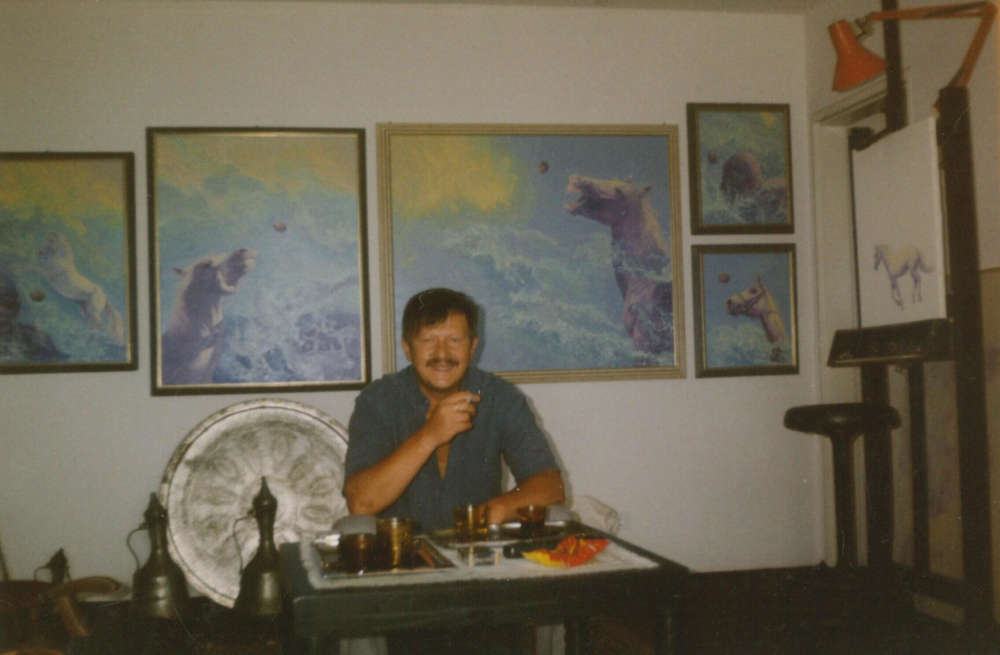 Painter Mihridžan Kulenovic Mimica sitting in his atelier in front of his paintings. 