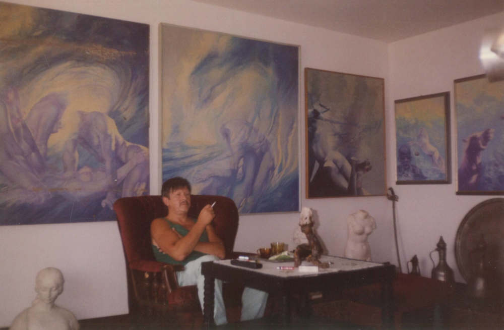 Painter Mihridžan Kulenovic Mimica, sitting in his atelier sorrounded by his paintings.  
